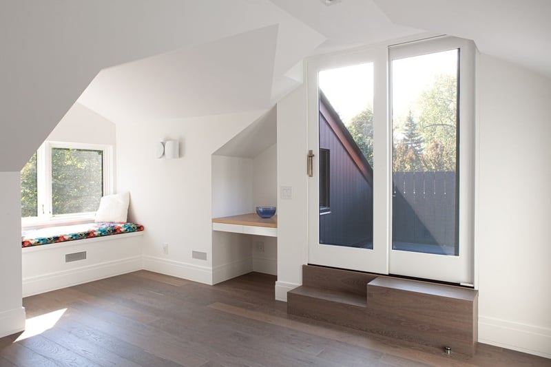 Glass front door to upper level of Toronto home renovation with white casing by SevernWoods