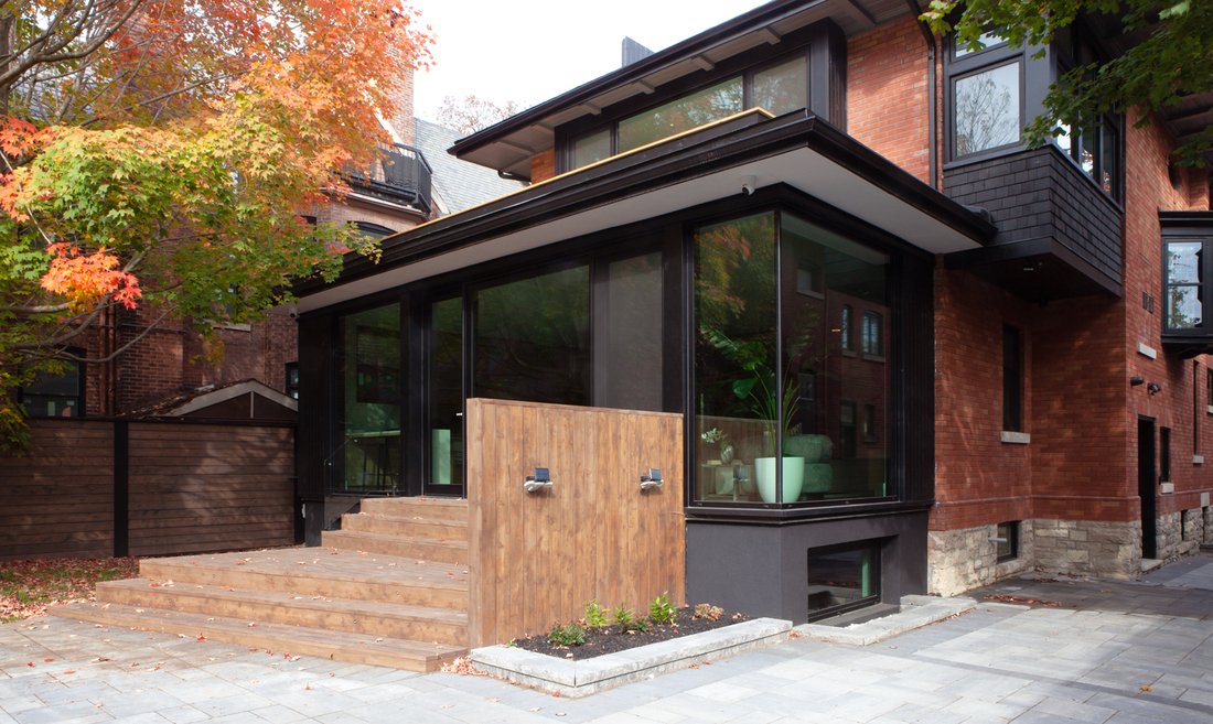 Back exterior view of Rosedale, Toronto custom home with floor-to-ceiling windows