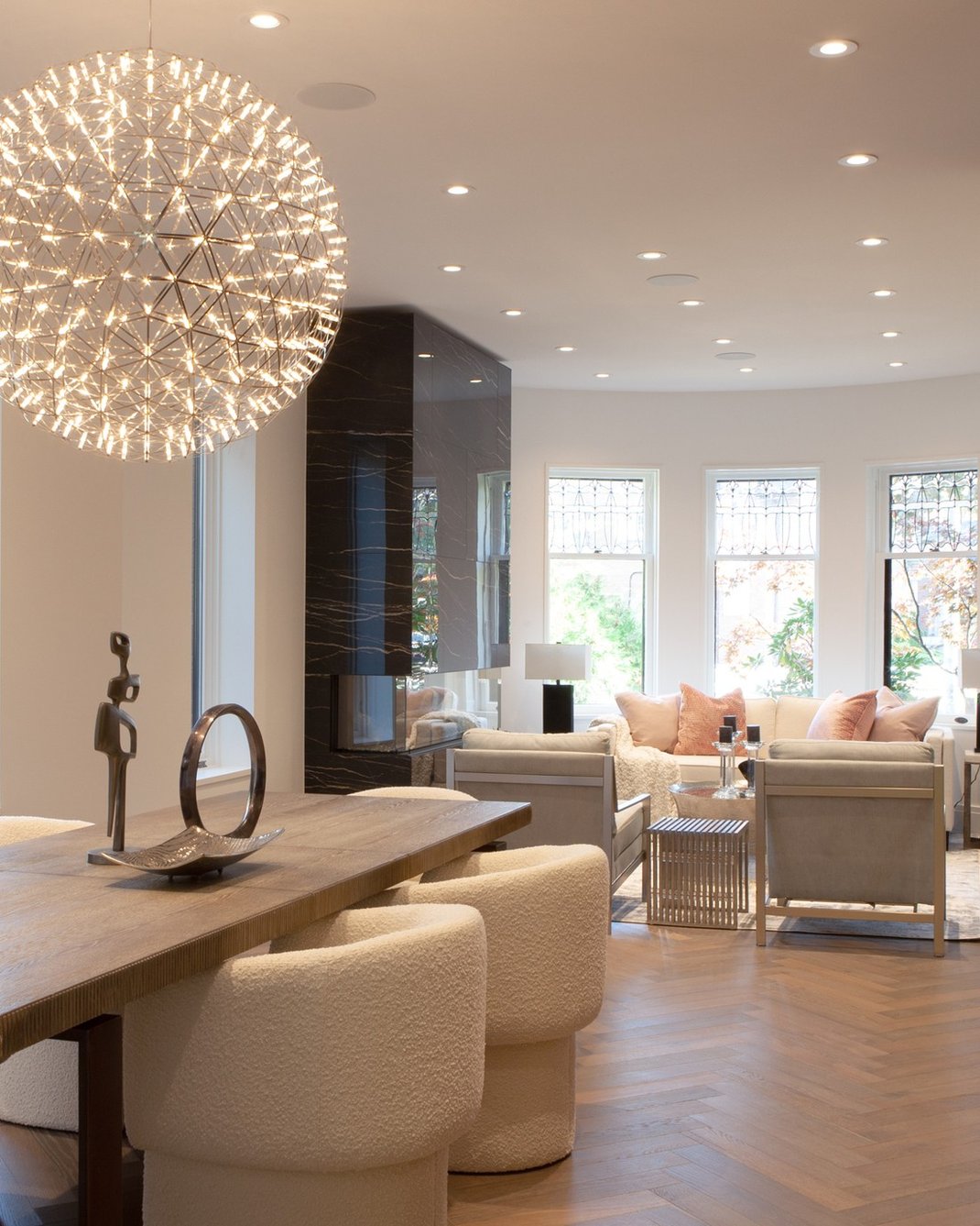 Large round chandelier above dining table in Rosedale, Toronto luxury custom home