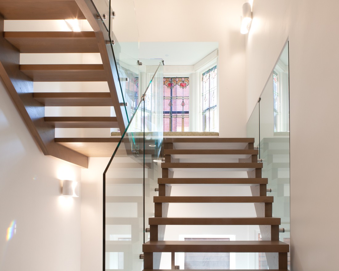 Modern staircase with glass panels in Toronto luxury custom home