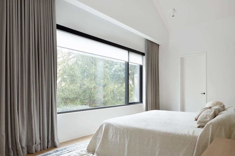 Recessed drapes in bedroom of Toronto luxury home by SevernWoods