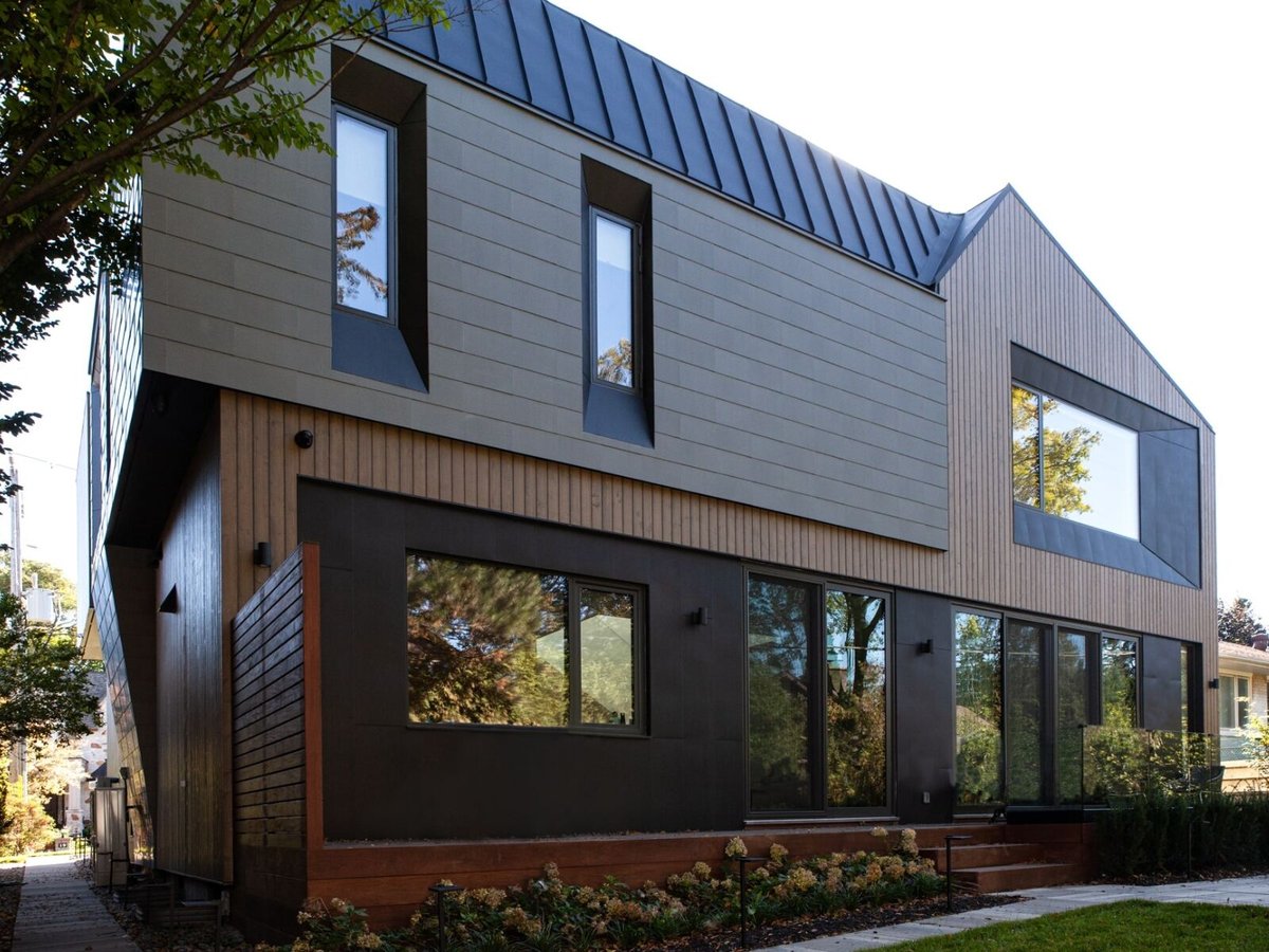 Back exterior custom home with zinc cladding roof