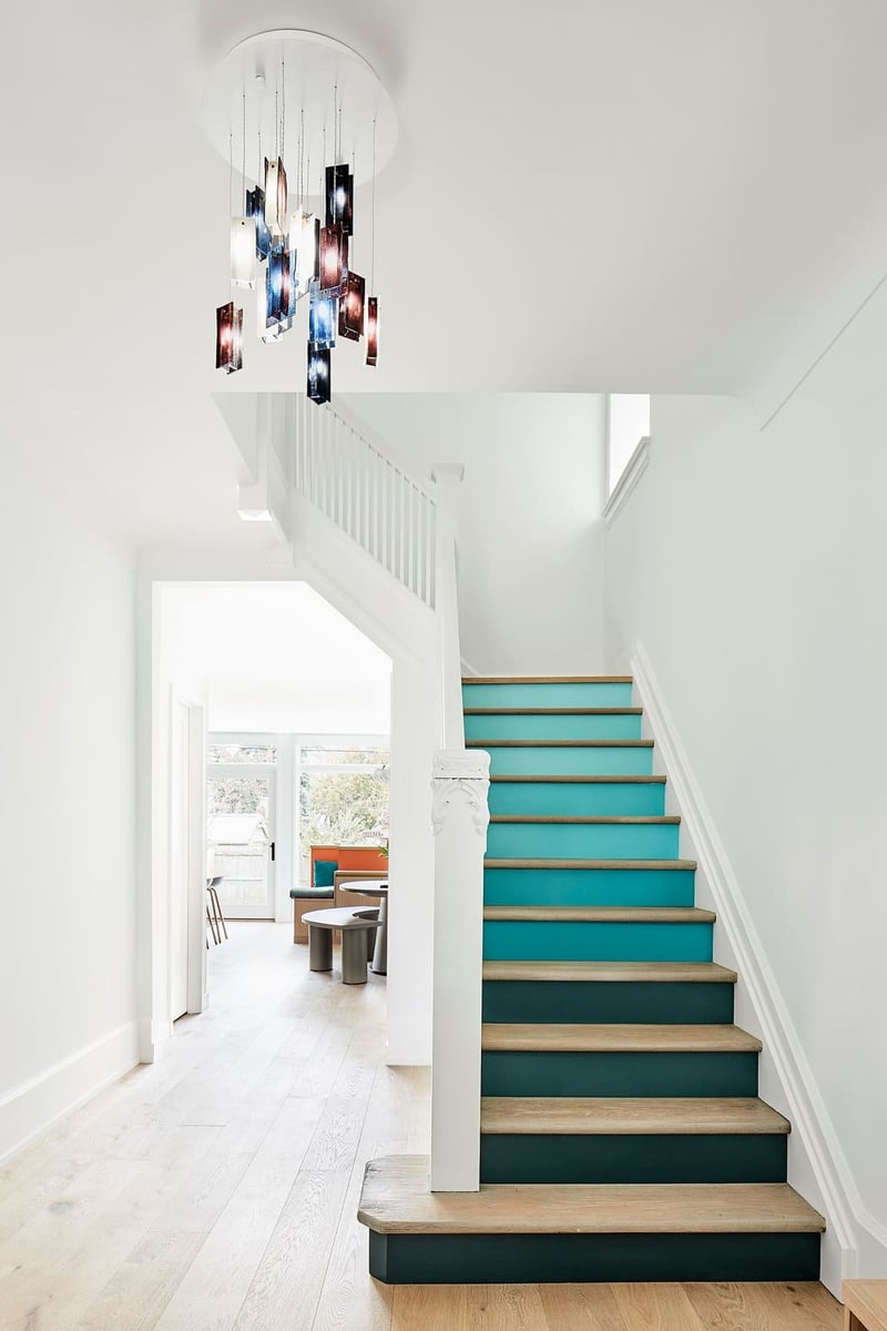 Blue staircase to second-storey of Toronto home renovation 