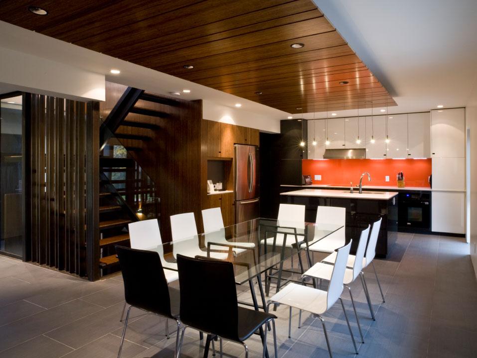 Custom kitchen renovation with orange backsplash and Plyboo