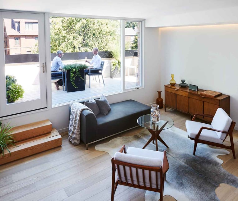 Living Space of Custom Home Leading Out to Custom Outdoor AArea