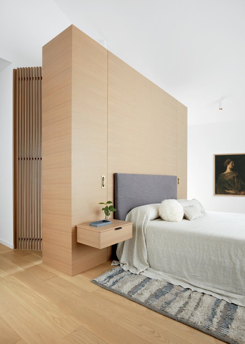 custom-modern-master-bedroom-with-closet-behind-bed-in-toronto