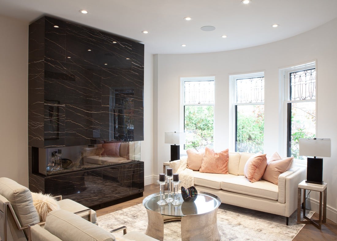 family-room-with-custom-stone-fireplace-and-recessed-lighting-by-severnwoods