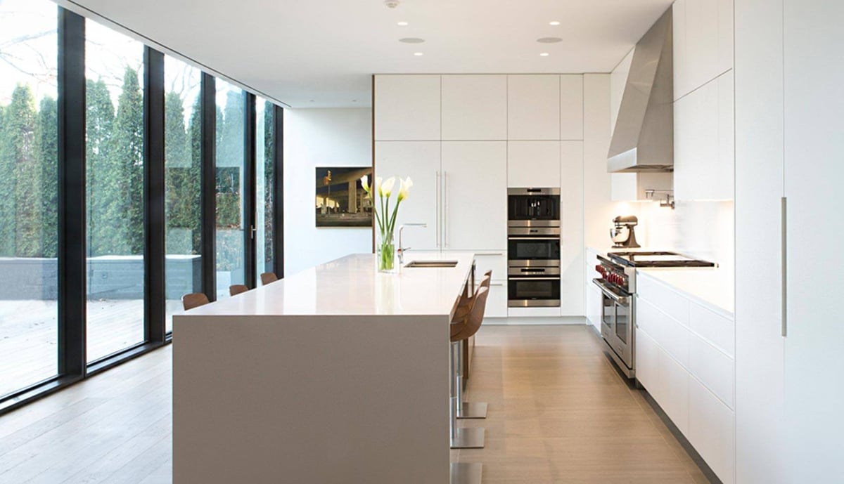 rosedale-custom-home-kitchen-white-cabinets-island-floor-to-ceiling-windows-severnwoods-toronto