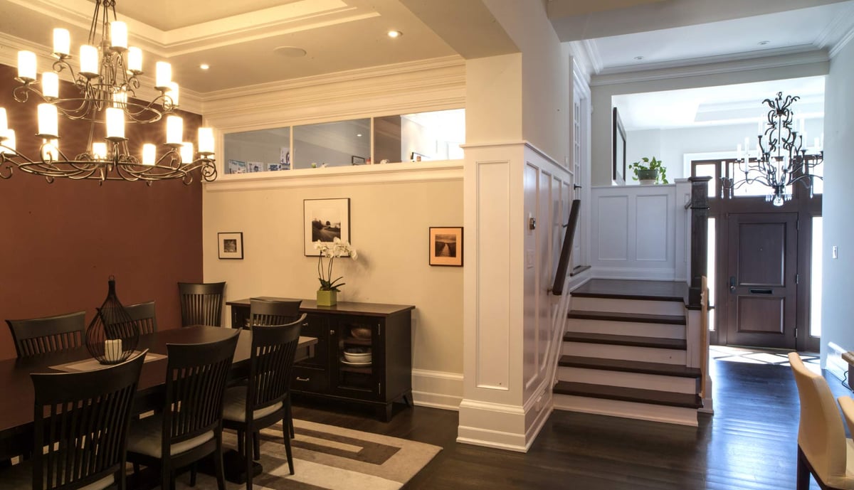 Foyer and dining room with stairs to second-story of Leaside, Toronto custom home