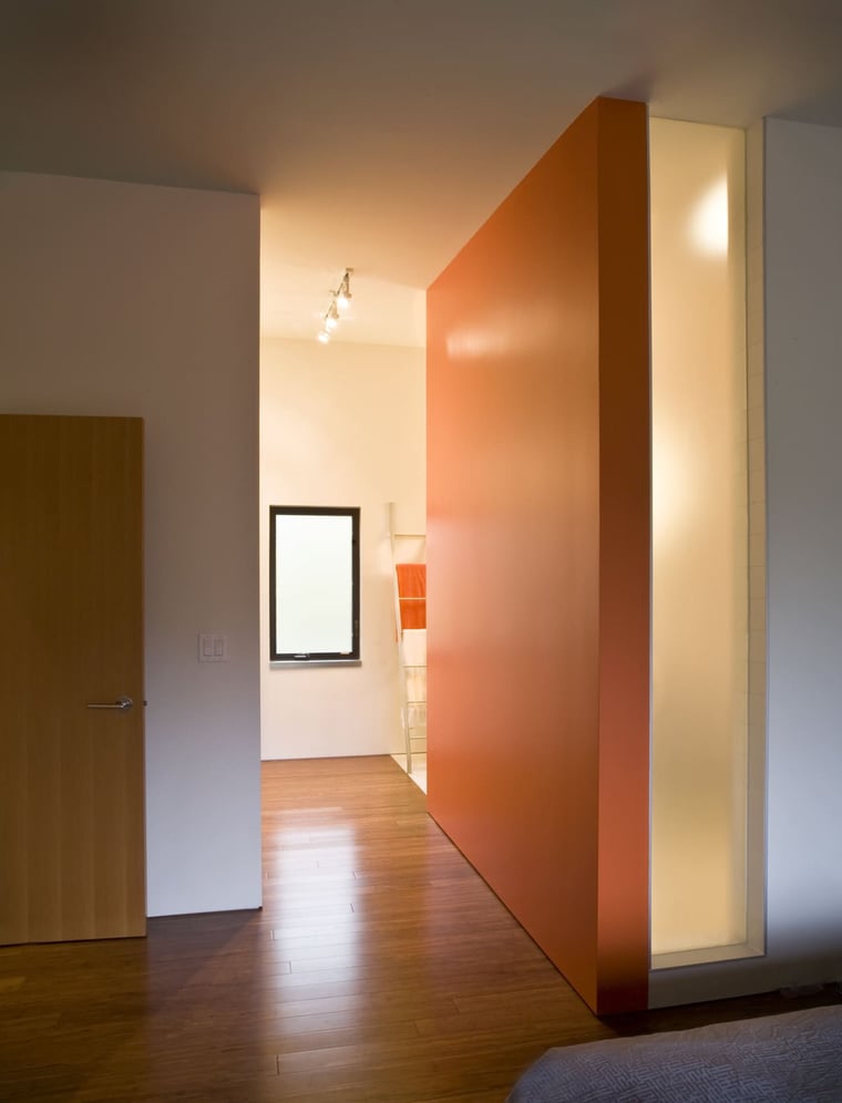 Interior of luxury home renovation in North York with in-floor heating system and orange accent wall