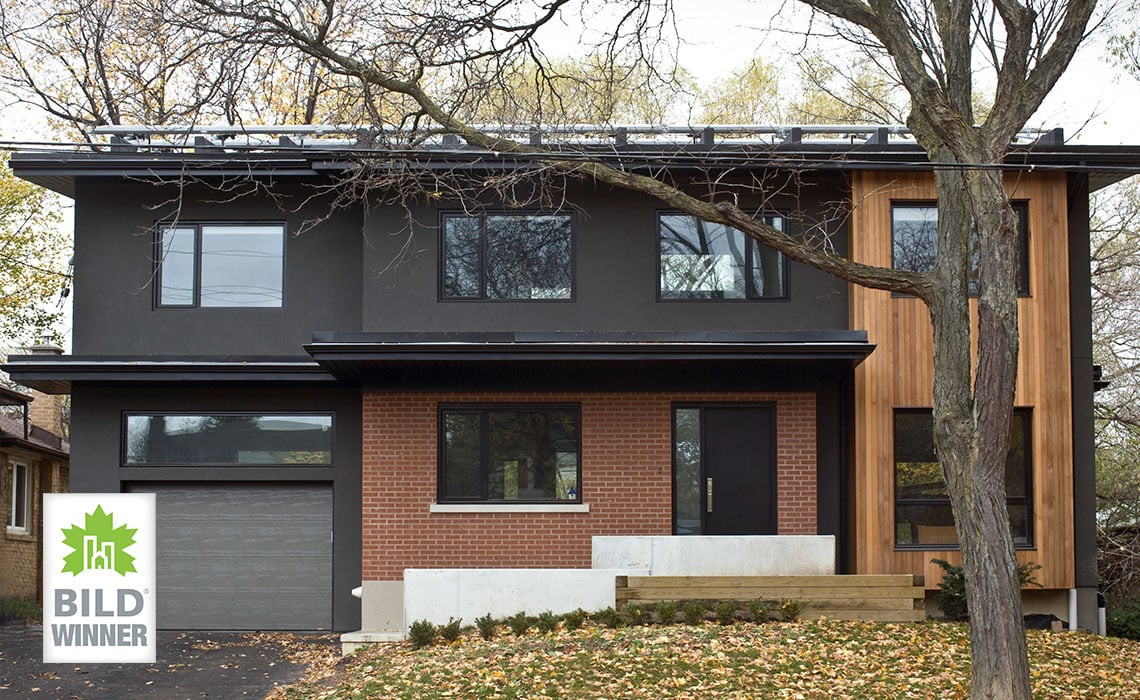 Luxury new construction home exterior in Toronto with attached garage