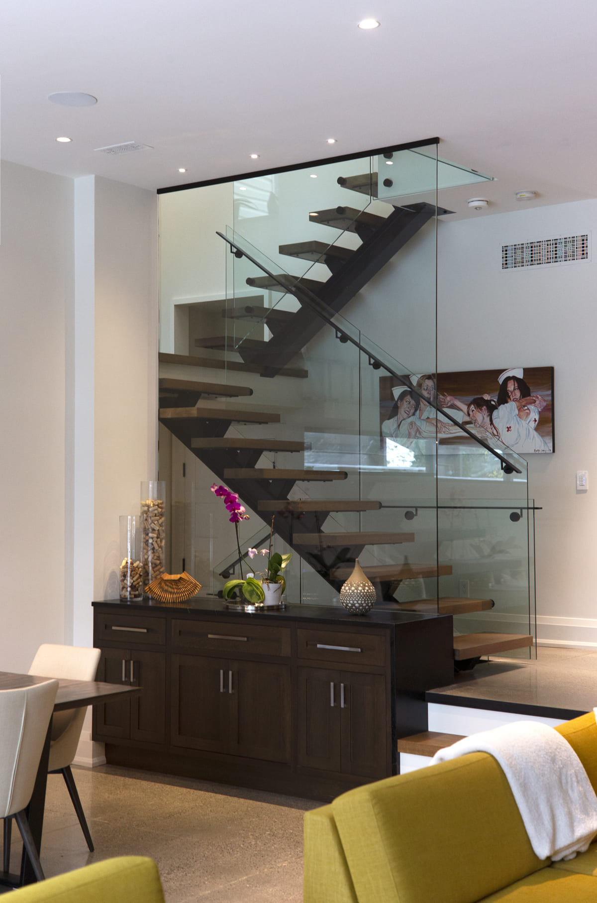 Staircase with glass panelling in Toronto home by SevernWoods