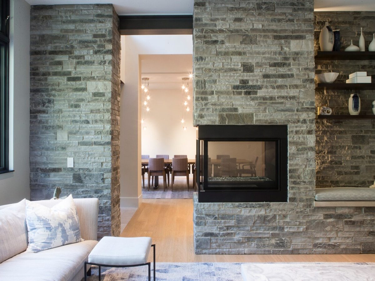 Toronto custom home with fireplace and thin stone veneer by SevernWoods