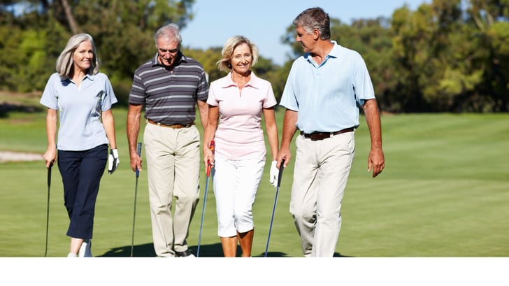 two older couples together on the golf course in toronto ontario canada