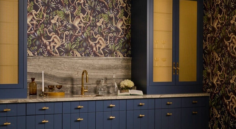 Bold bar design with navy cabinetry by Bloomsbury Kitchens and print wallpaper in Toronto custom home by SevernWoods, photographed by Alex Lukey Photography