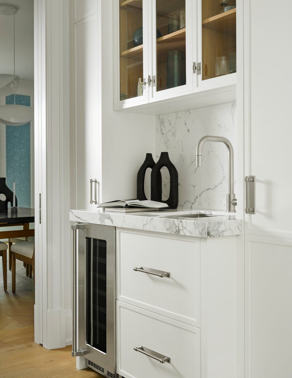 Built-in bar area with plumbing by Cesario & Co and cabinetry by Bloomsbury Kitchens in SevernWoods custom home, captured by Alex Lukey Photography