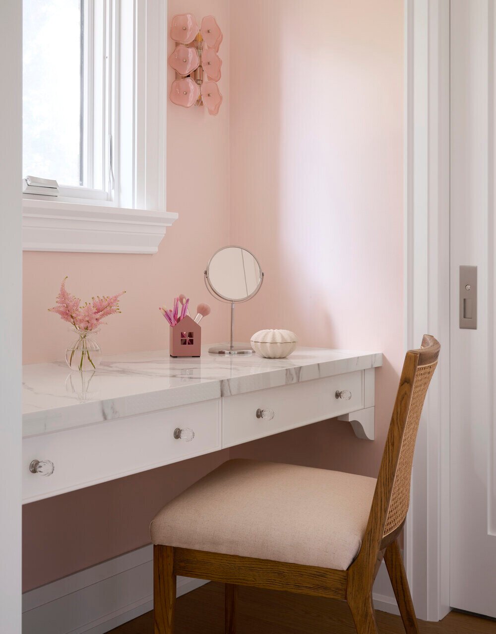 Custom makeup station with cane-back chair and pastel decor in SevernWoods Toronto project, photographed by Alex Lukey Photography