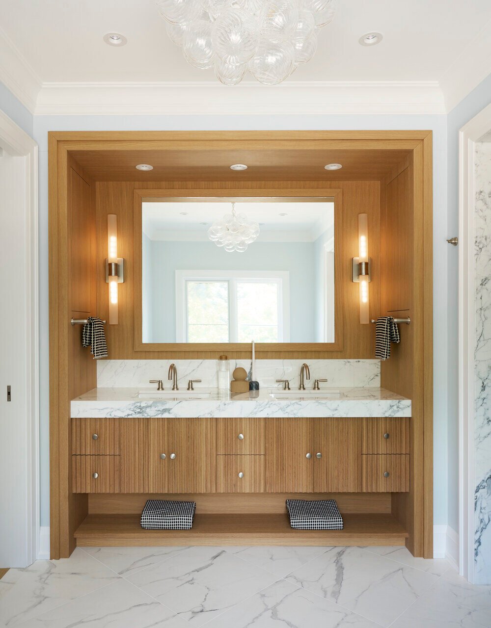 Double vanity design with cabinetry by Select Surfaces Corp and plumbing by Cesario and Co in Toronto luxury home by SevernWoods, photographed by Alex Lukey Photography