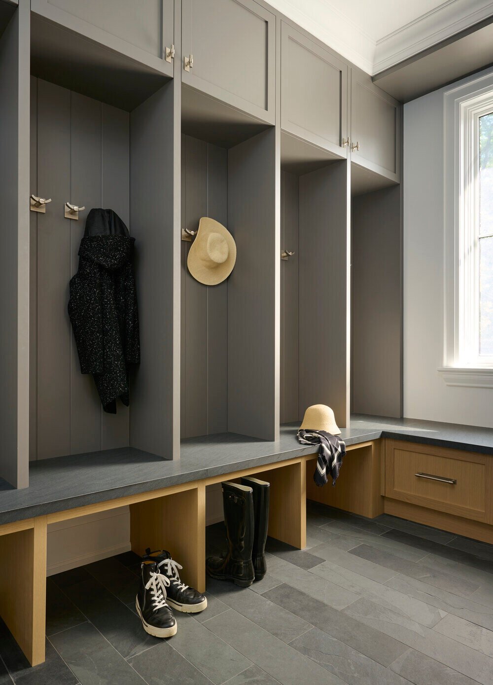 Mudroom cubbies with integrated bench and storage in a SevernWoods custom home in Toronto, captured by Alex Lukey Photography