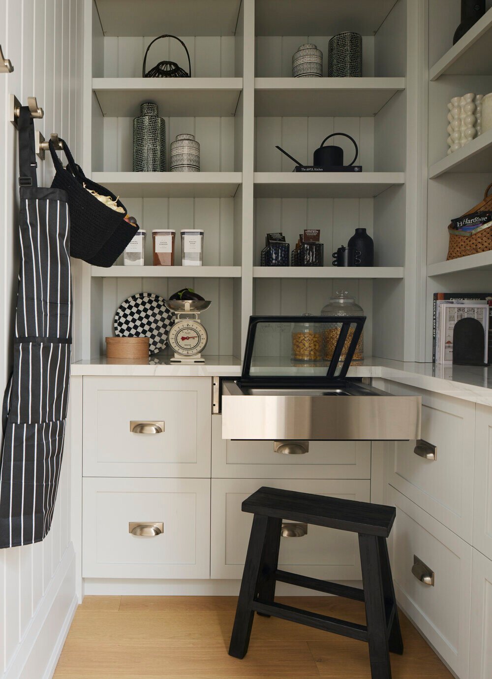 Pull-out vacuum wrap drawer built into luxury pantry by SevernWoods Fine Homes in Toronto, photographed by Alex Lukey Photography