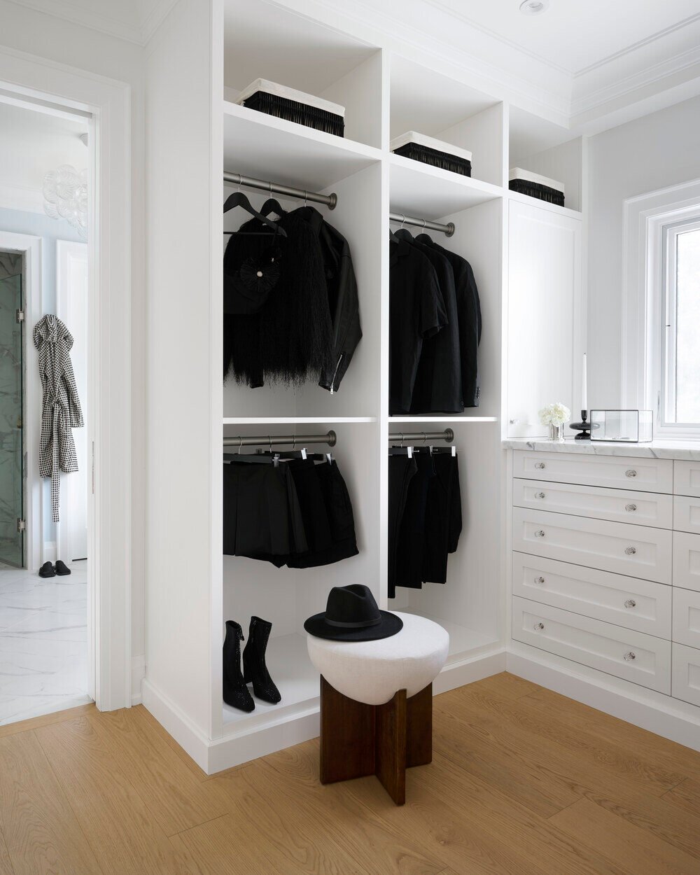 Walk-in closet with black wardrobe accents in SevernWoods luxury build, Toronto, photographed by Alex Lukey Photography
