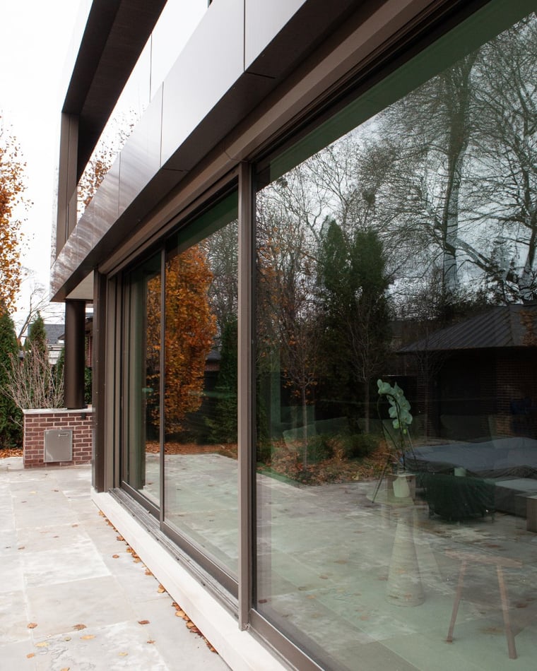 Floor-to-ceiling frosted low-iron window exterior on Toronto home addition and renovation by SevernWoods