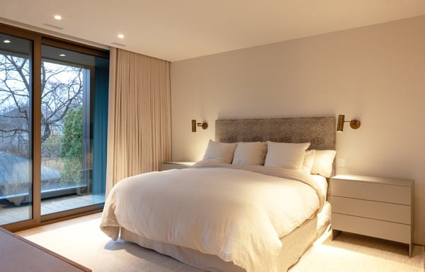 Primary suite with floor-to-ceiling windows and recessed drapes in Toronto renovation and addition by SevernWoods Primary suite with floor-to-ceiling windows and recessed drapes in Toronto renovation and addition by SevernWoods