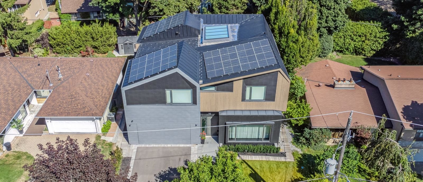 aerial rooftop modern zinc cladding with solar panels and skylight in home renovation