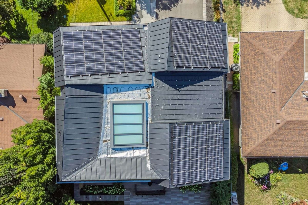 aerial rooftop view of zinc cladding with solar panels in Toronto