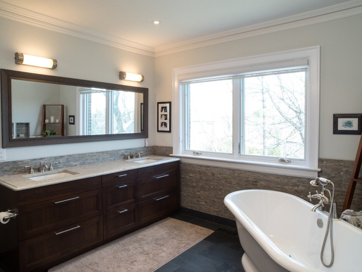Bathroom in custom home with double vanity and freestanding tub in Leaside, Toronto