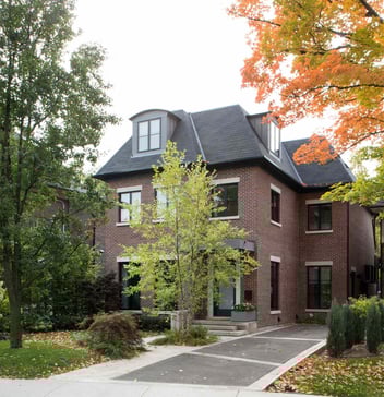 custom home in toronto with trees in lot