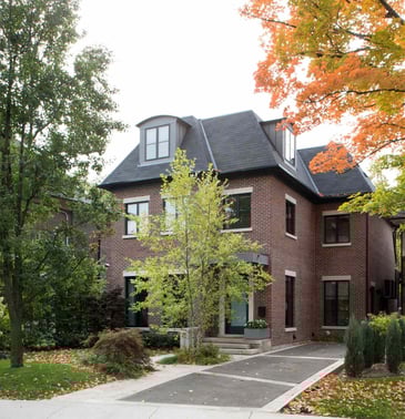 custom home in toronto with trees in lot