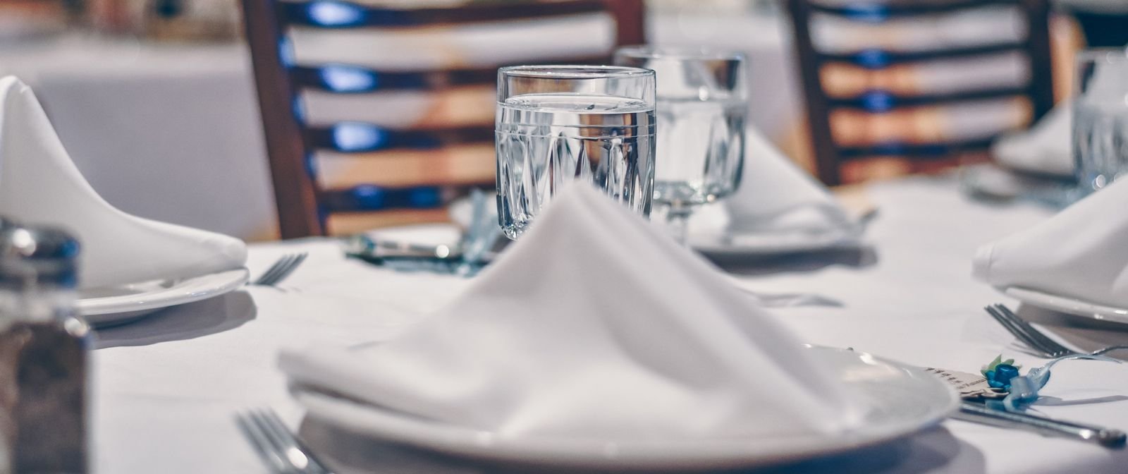 formal dining in private club in toronto of napkin on plate