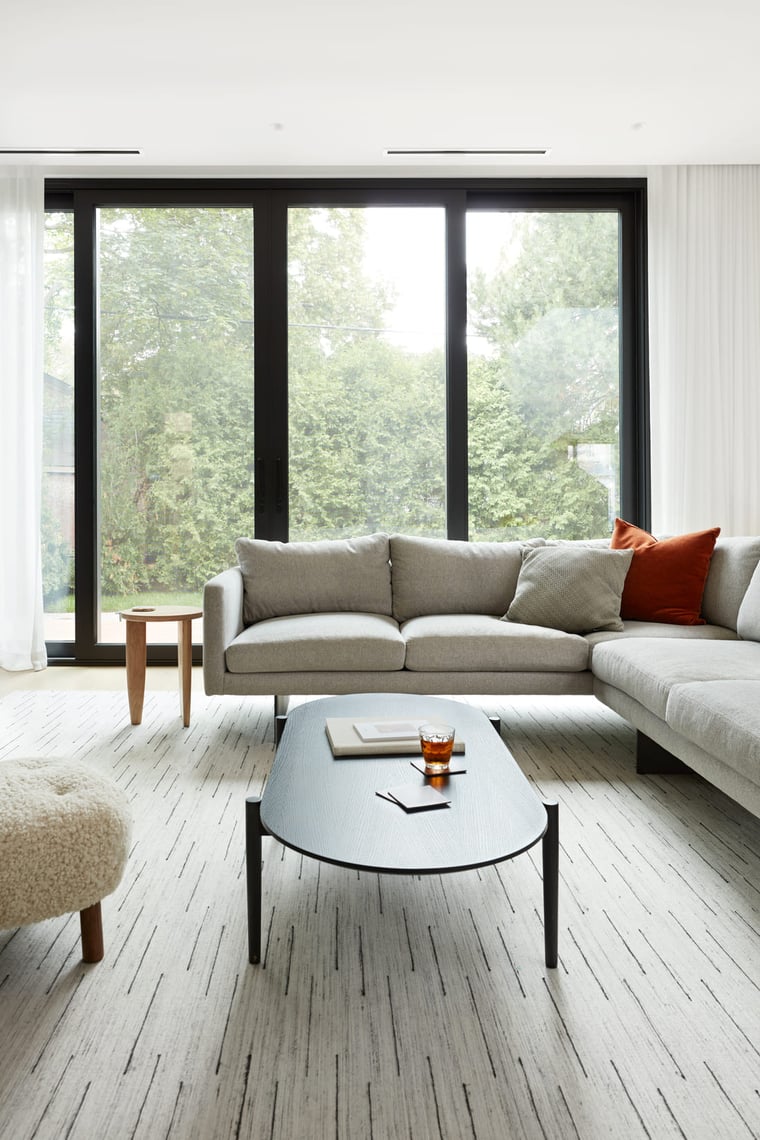 Luxury living room area with floor-to-ceiling windows