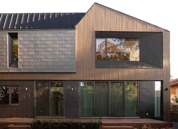 Modern custom home in Toronto backyard exterior with windows