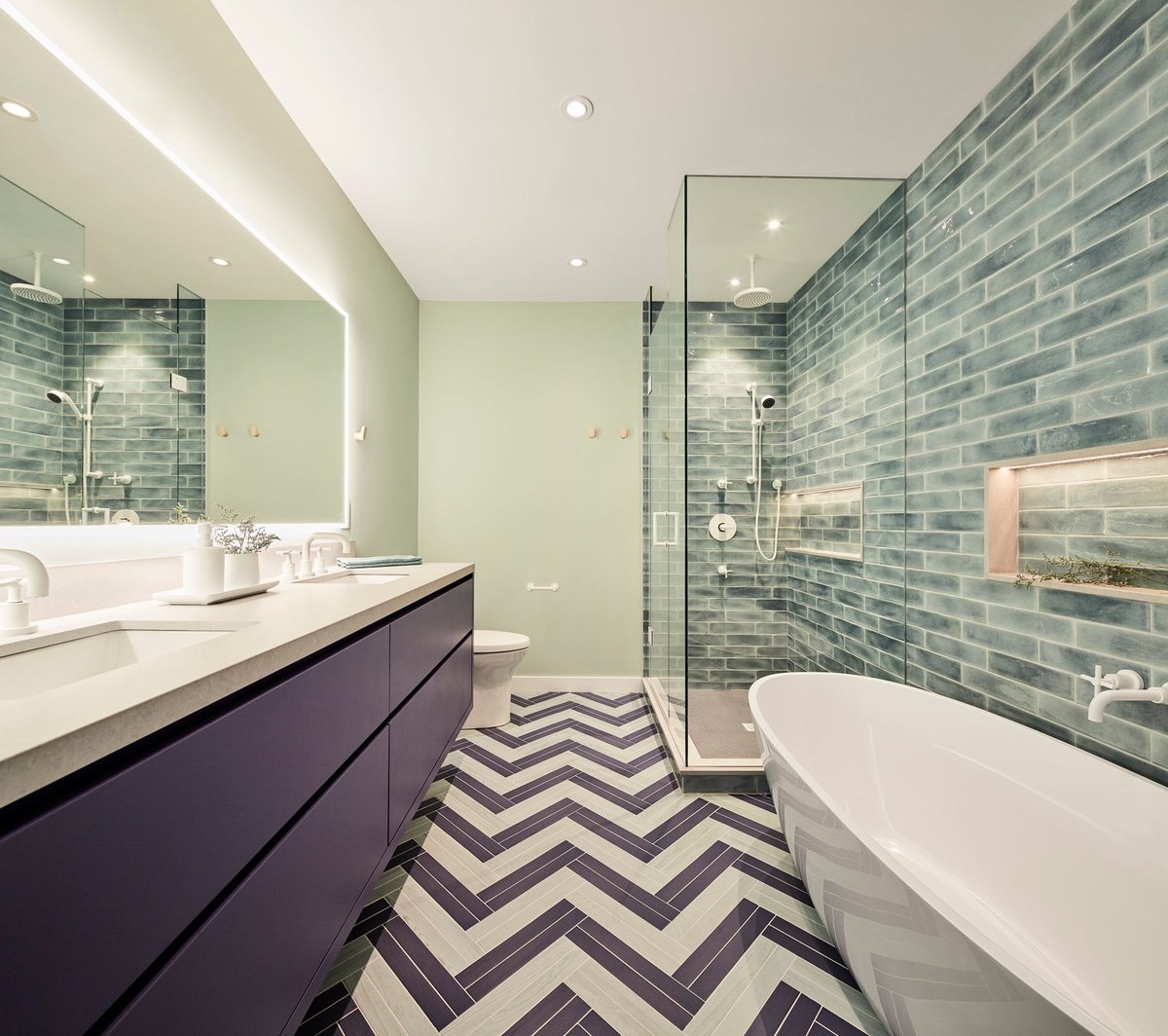 Purple contemporary bathroom with herringbone pattern flooring and walk-in shower and soaking tub