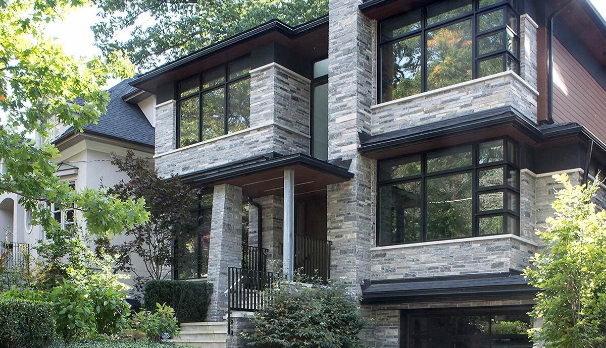 SevernWoods custom home exterior during day with stone exterior