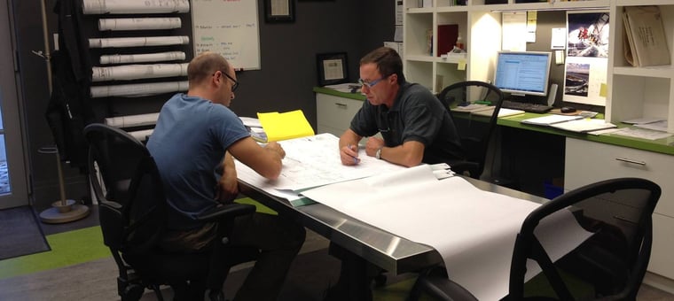 tom cumming and architect working together on blueprint for custom home (1)-1