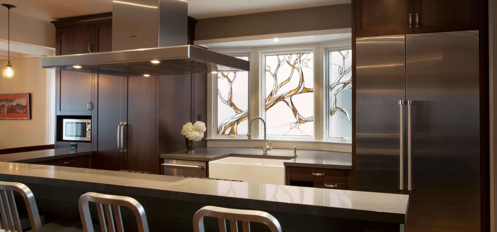 toronto luxury kitchen renovation with island and hanging range hood
