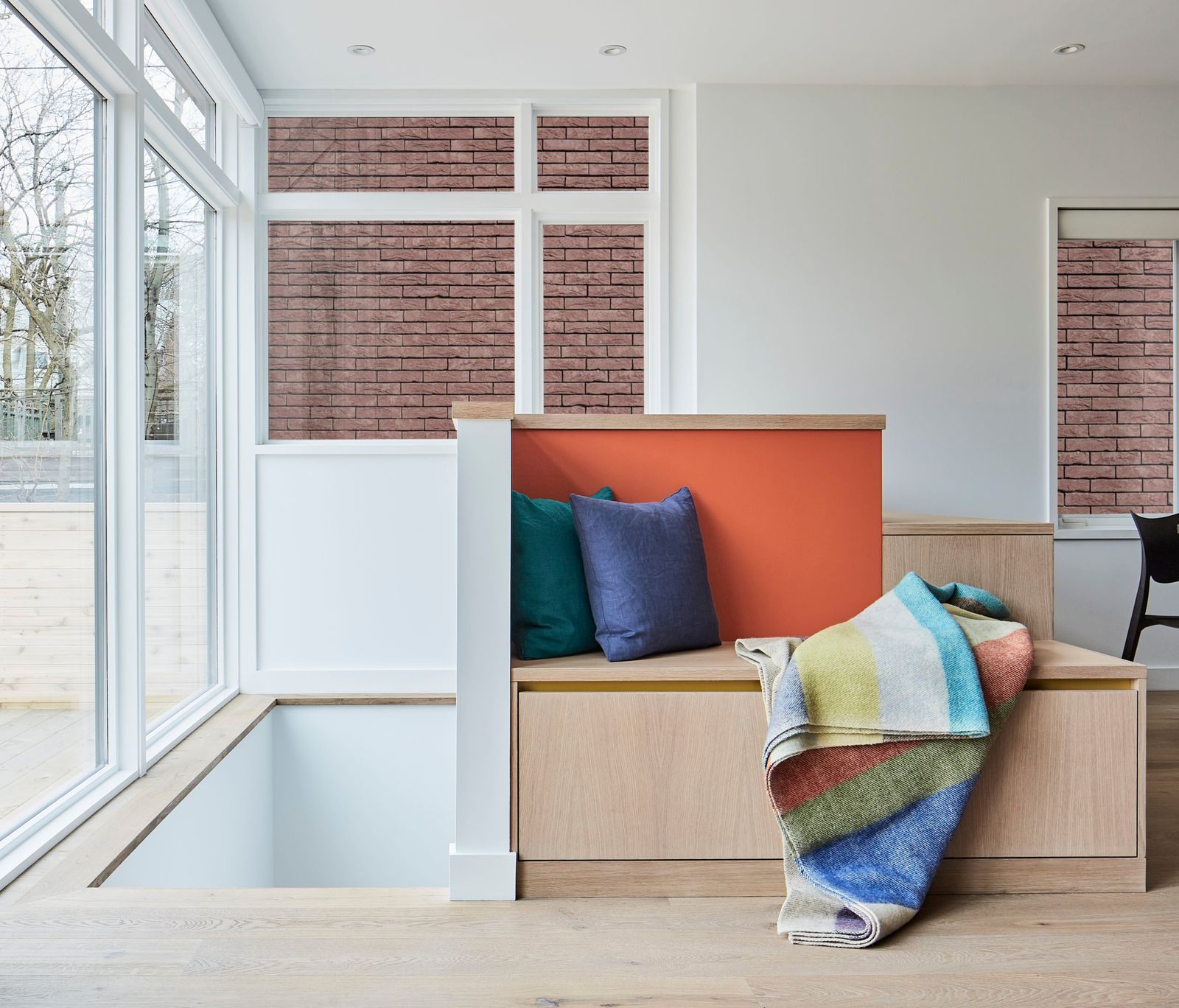 view-of-custom-stairs-leading-to-basement-with-pop-of-orange