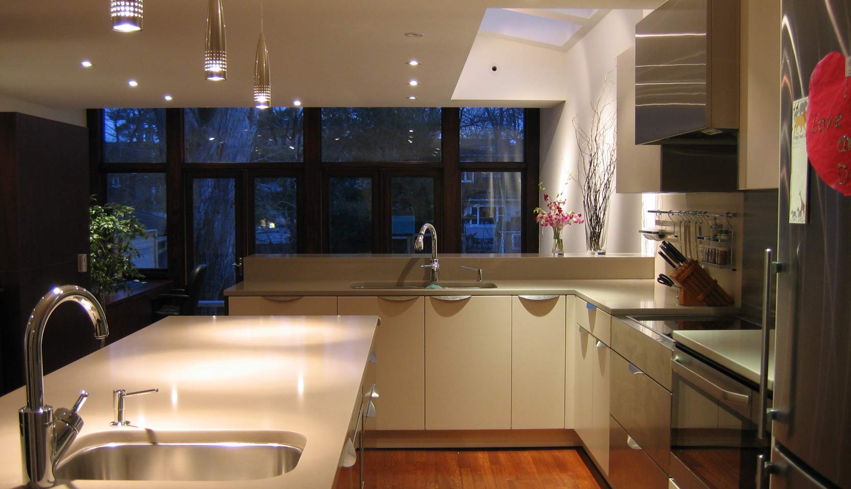 kitchen-cream-cabinets-stainless-hood-island-night-lytton-park-severnwoods-toronto