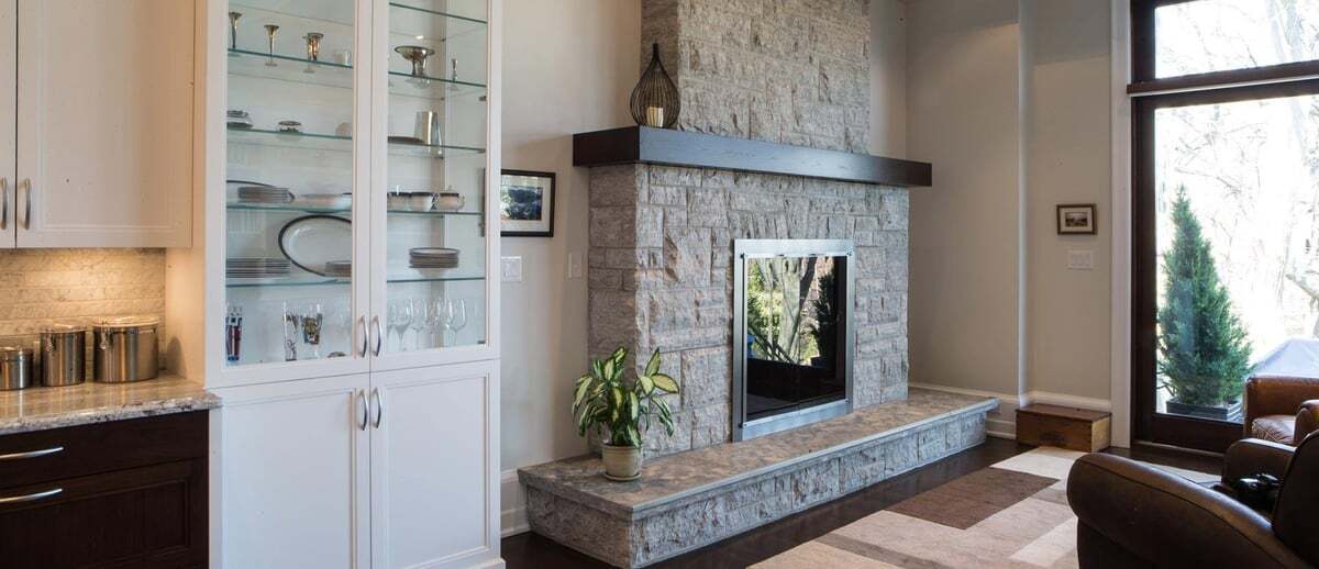 limestone-fireplace-glass-cabinet-living-room-leaside-severnwoods-toronto