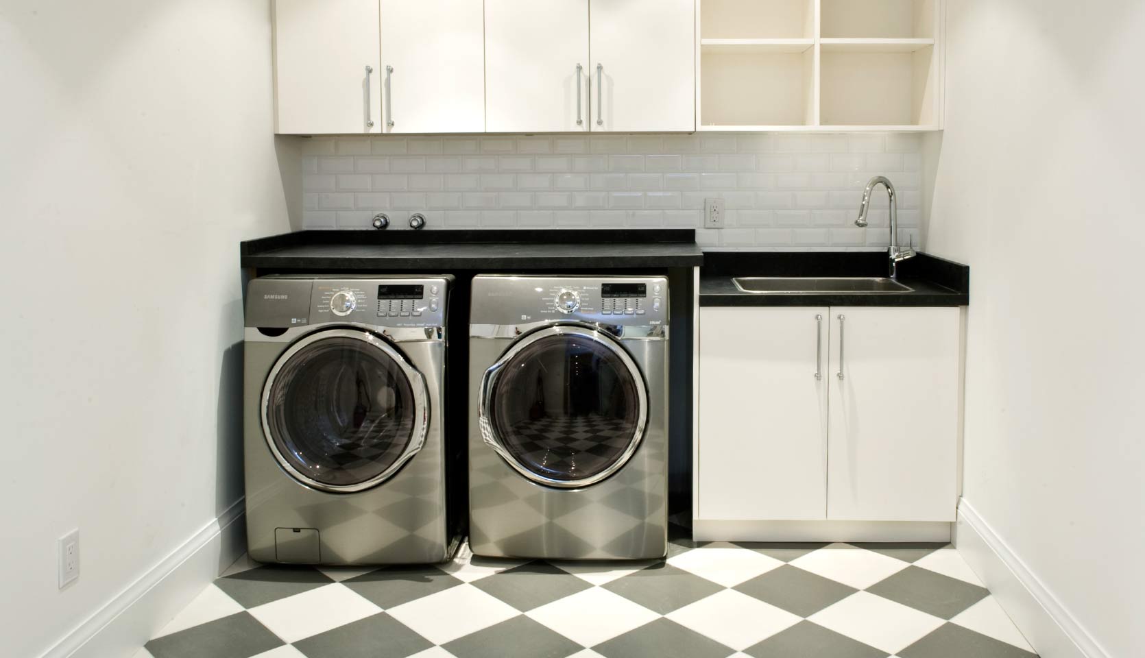 laundry-room-washer-dryer-white-cabinets-black-countertop-little-italy-severnwoods-toronto