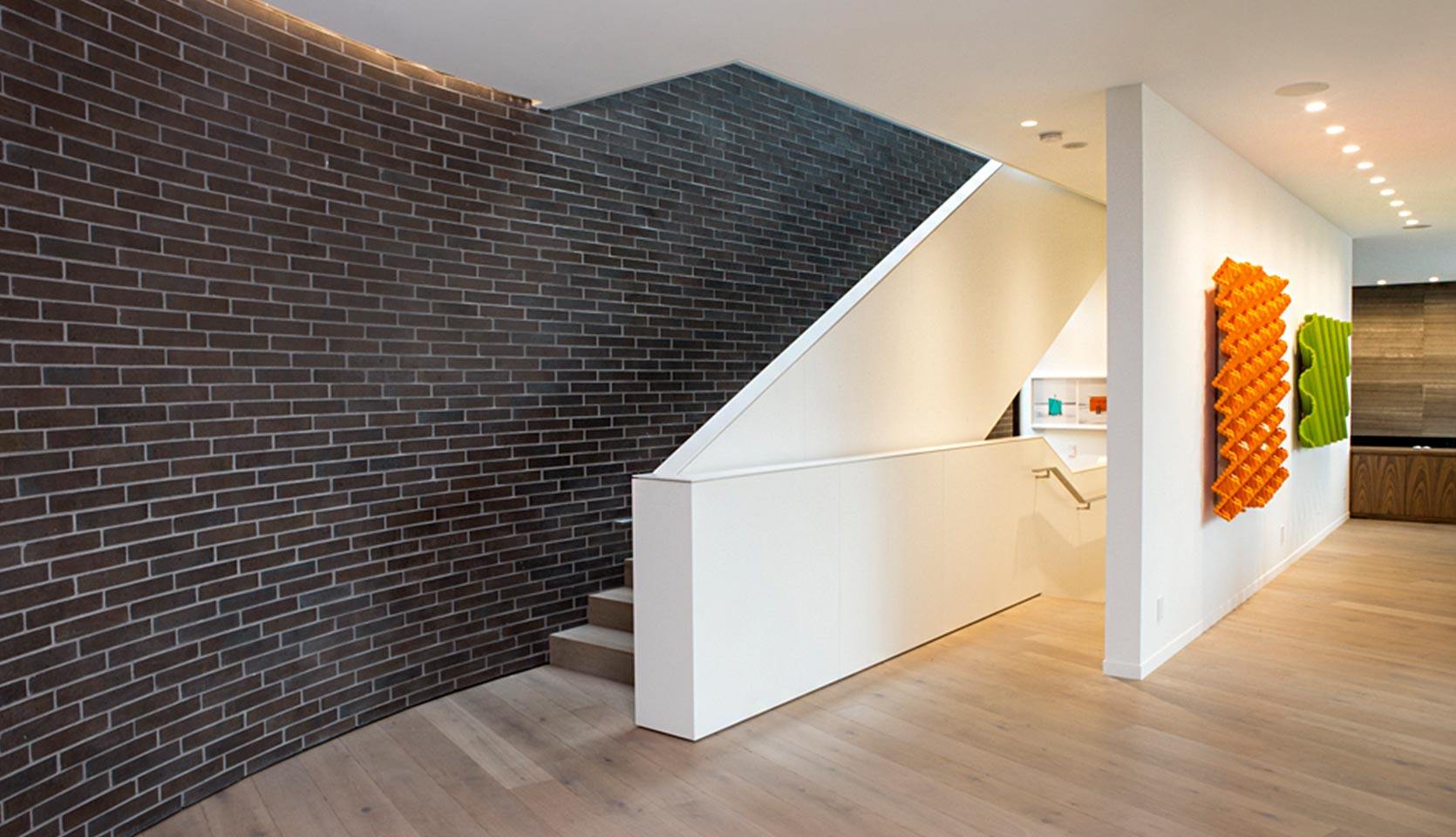 rosedale-custom-home-staircase-dark-brick-wall-severnwoods-toronto