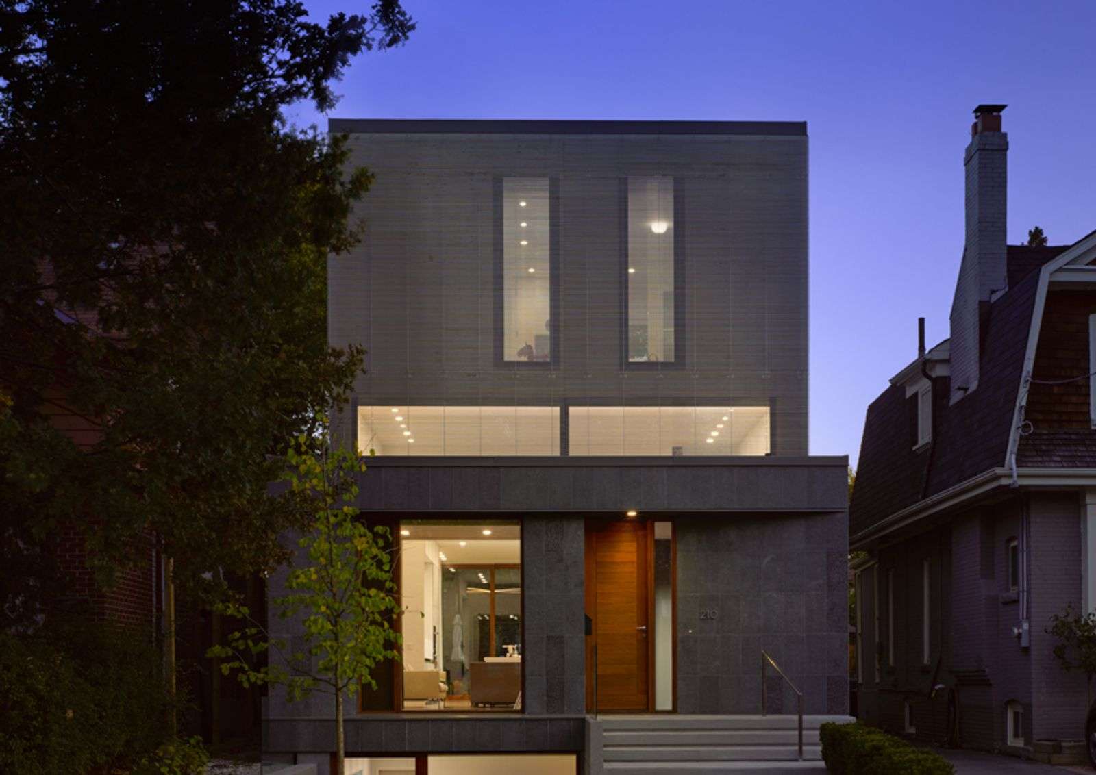 Modern Custom in lytton park Toronto exterior with interior lit with smart lighting