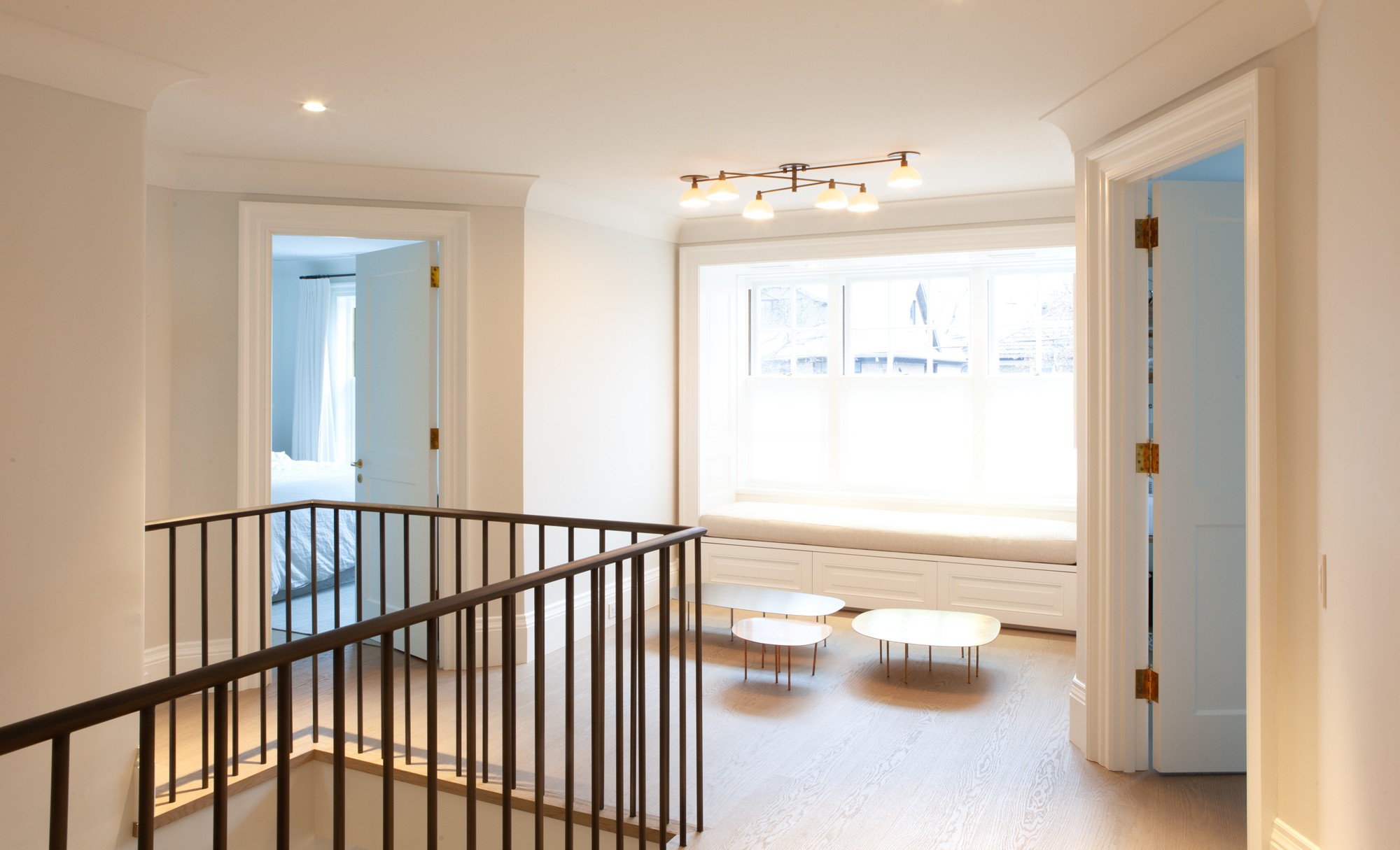 Traditional railing design on staircase of second-storey in Toronto addition and renovation