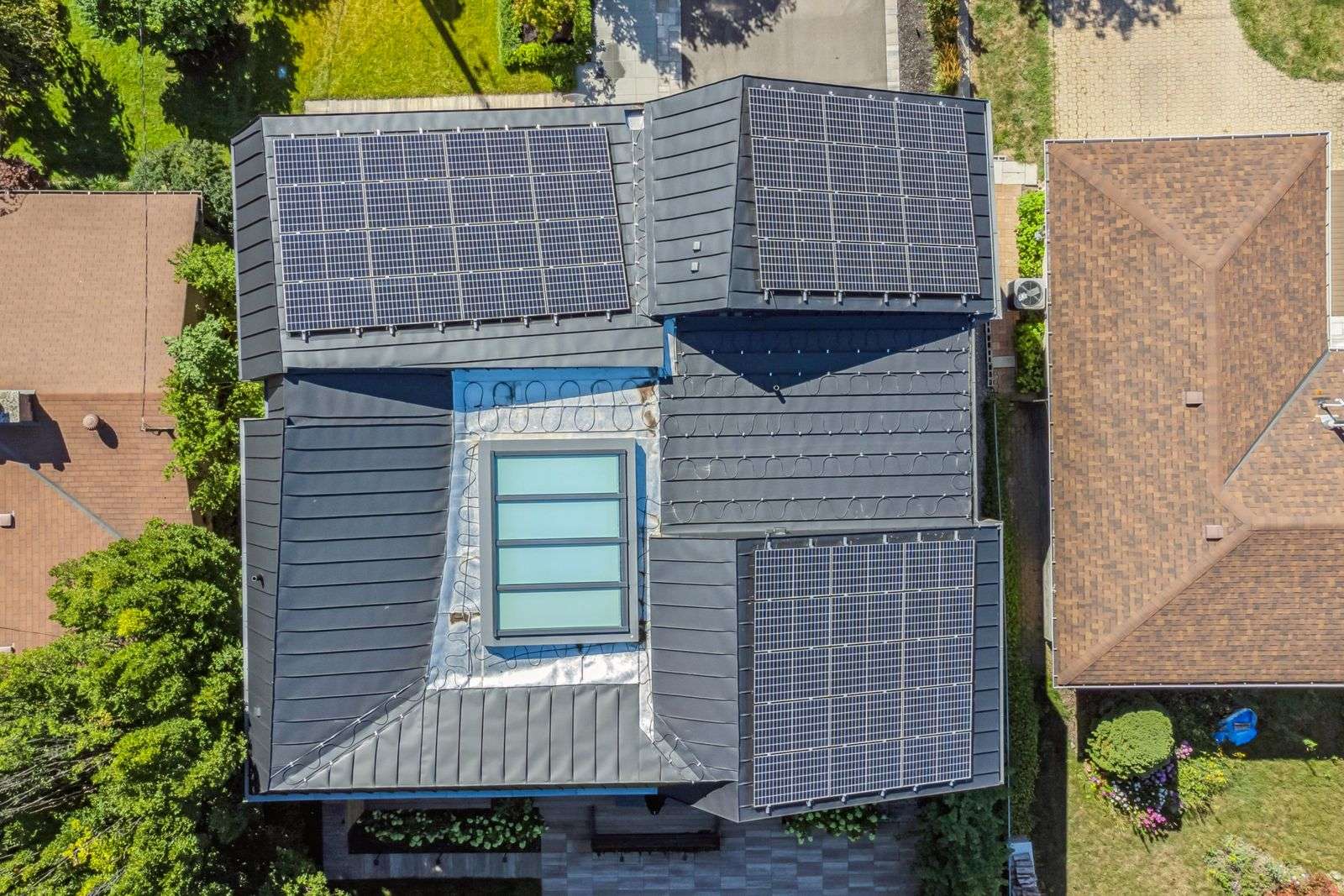 aerial rooftop modern zinc cladding with solar panels and skylight in home renovation in toronto6 aerial rooftop modern zinc cladding with solar panels and skylight in home renovation in toronto6