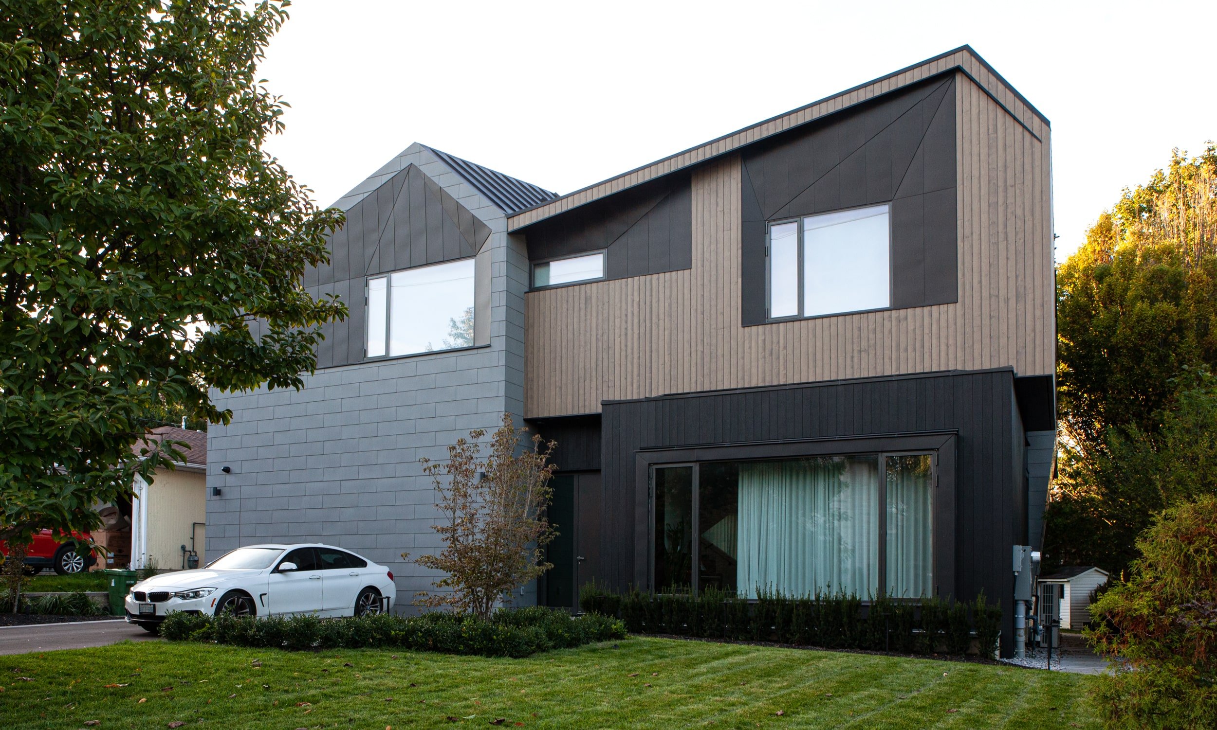 architectural designed toronto custom home front exterior with flush garage zinc cladding