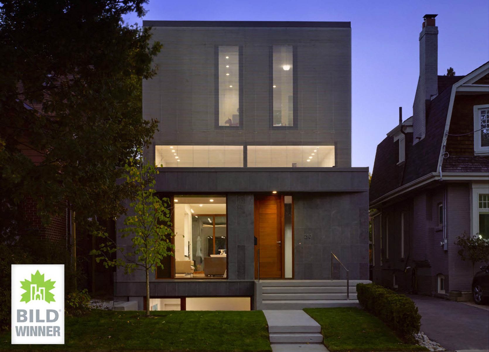 Front Home Exterior of Contemporary Custom Home with flamed Basalt stone