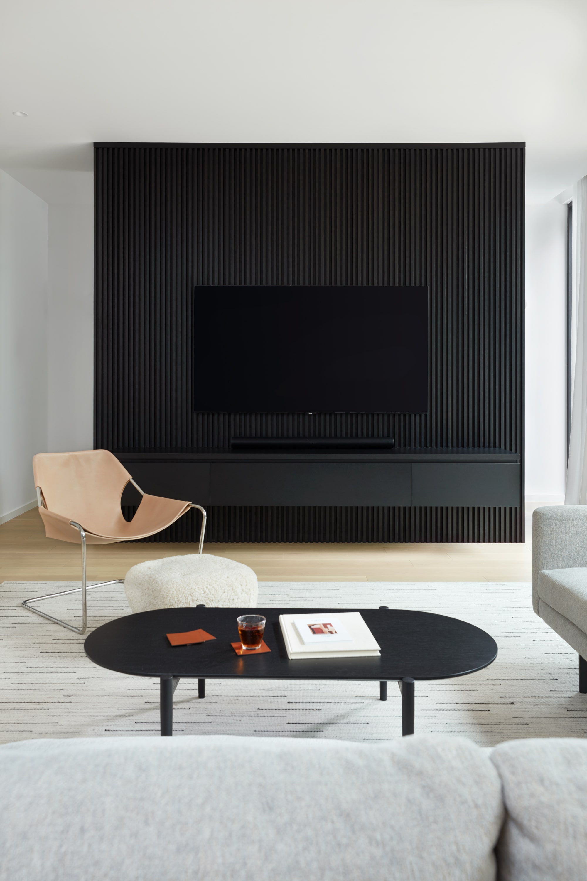 custom modern black fireplace against wall in toronto custom home